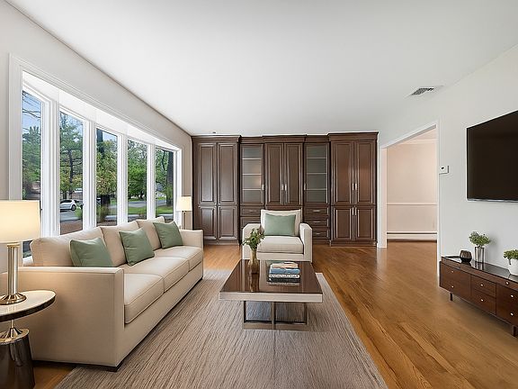 Sunny Living Room with Custom Built-Ins; Virtually Staged Image