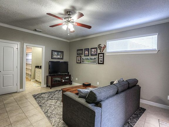 Natural light flows through the space from the double pane window with 2 inch wood blinds.