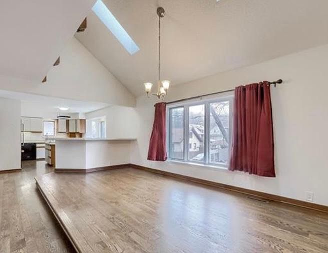 Open floor plan upon entering the unit. Updated hardwood floors.