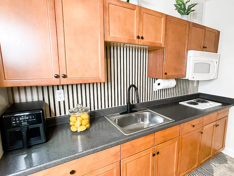 Well-equipped kitchen with ample counter space.