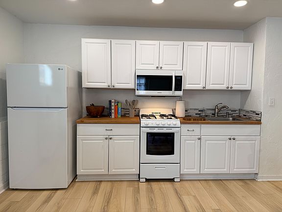 Kitchen is equipped with a full size refrigerator, stove/oven and microwave. Dishes, pots, glasses, mugs and utensils are included as well.