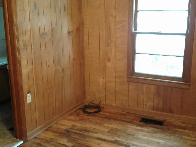 Rear bedroom, entrance to bathroom