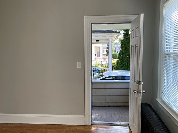 Doorway to side balcony off living room.