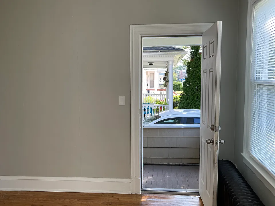 Doorway to side balcony off living room.