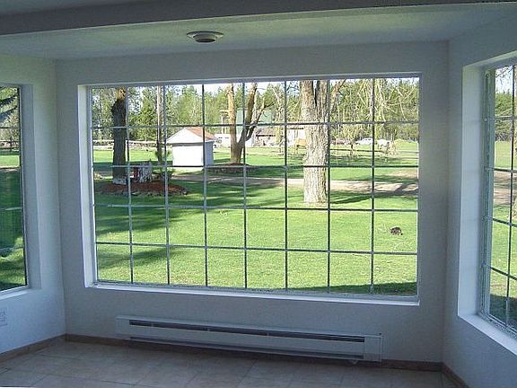 Look over yard from eating area in kitchen