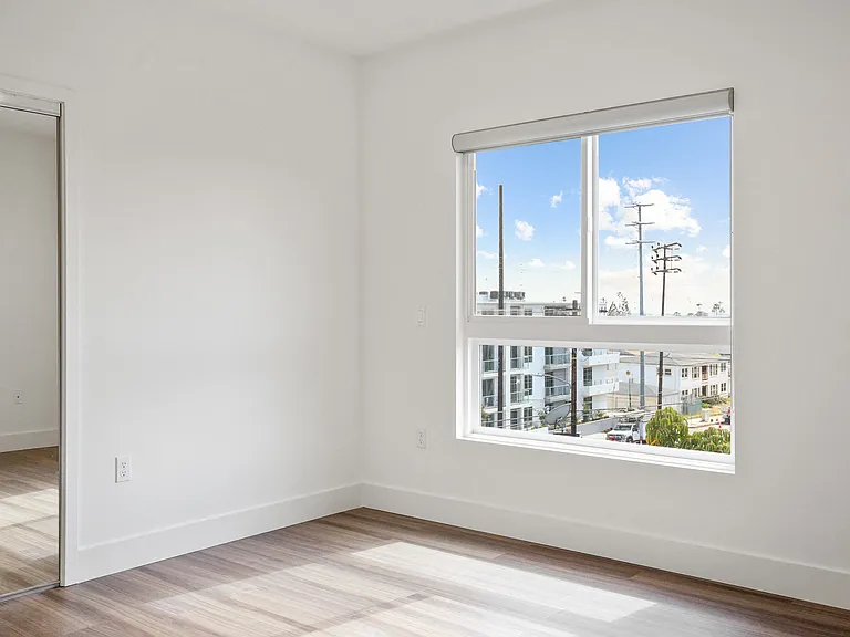 Bedroom with Closet and Large Windows