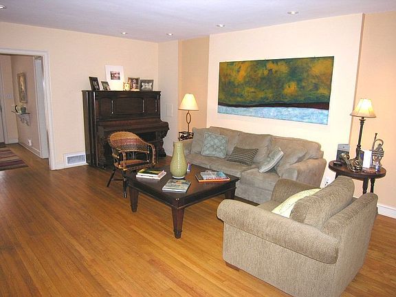 Living Rm is Open to the Dining Rm & Sunroom & Features Built-In Bookshelves!