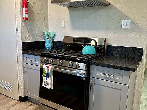 Stove top has an attachment for a center griddle, and has a self cleaning oven. The exhaust fan also is lighted using LED.