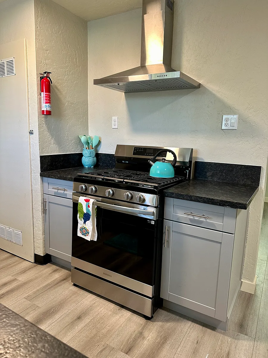 Stove top has an attachment for a center griddle, and has a self cleaning oven. The exhaust fan also is lighted using LED. - 763 Hayes Ave #2