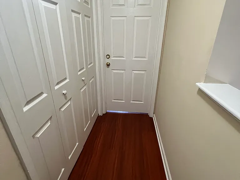 Pathway to bedroom #3 (straight) and washer/dryer (on left) [Upstairs]