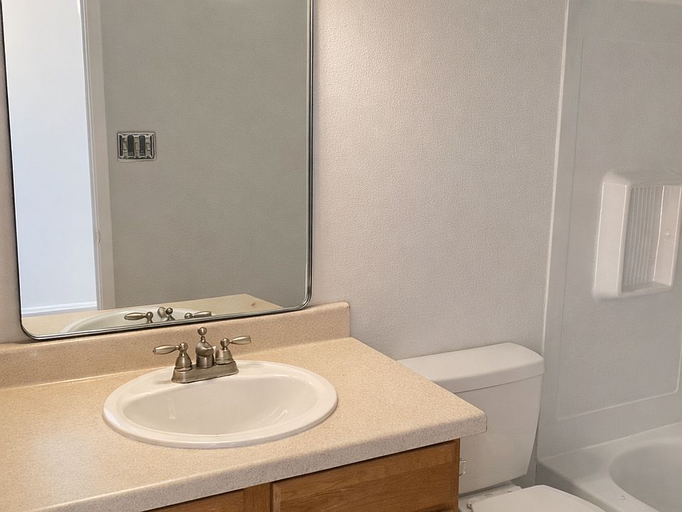 Freshly painted bathroom with a new mirror and lighting