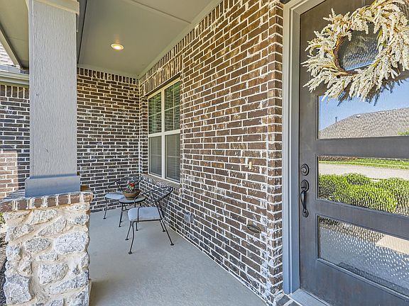 View of front porch and doorway to property