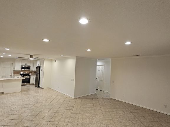 Open living room/dining room/breakfast bar/back yard entry via sliding glass door/laundry room