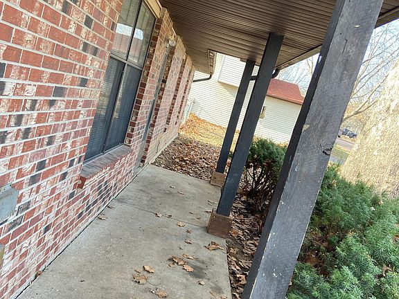 Front porch doesn't show off the green front door.