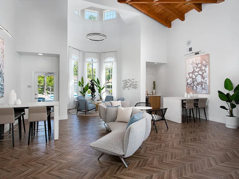 Resident lounge and leasing area with coworking spaces and lounge seating