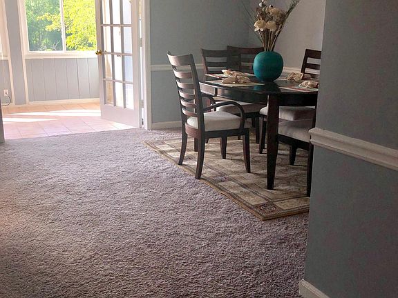 Dining room leading to large sunroom