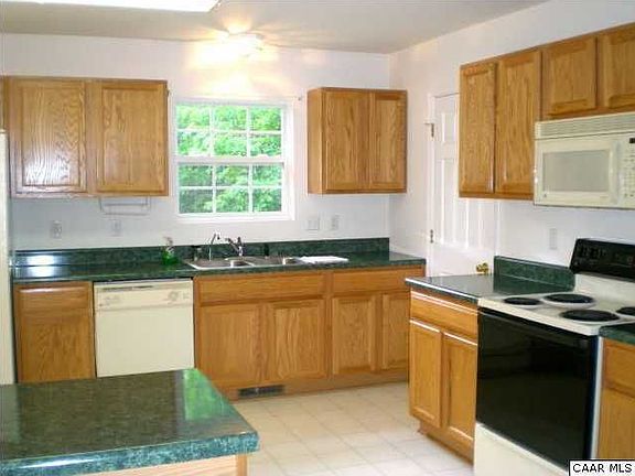 Kitchen overlooking backyard
