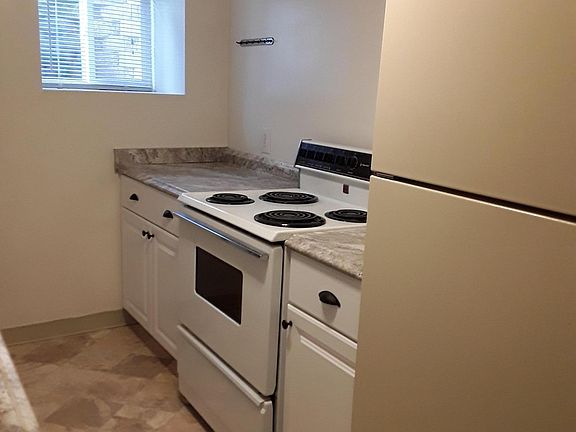 Kitchen with stove, microwave and refrigerator