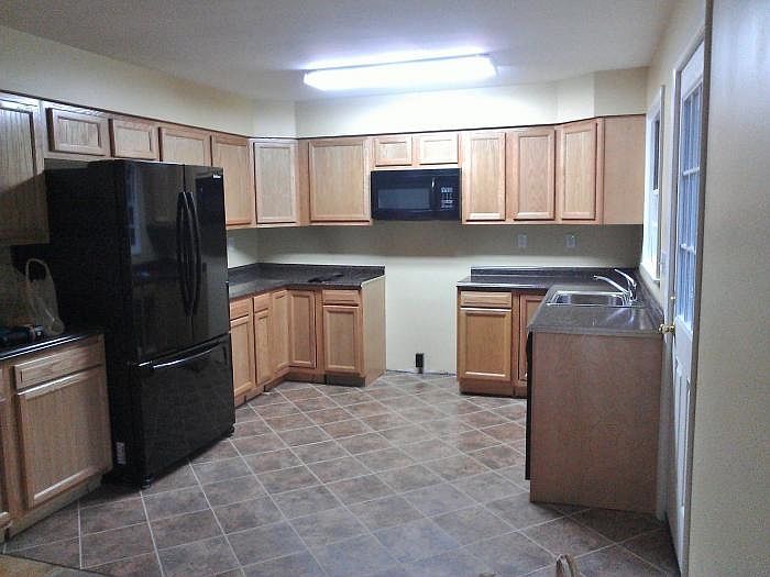 KITCHEN (WITH STOVE) OPENS TO DINING ROOM