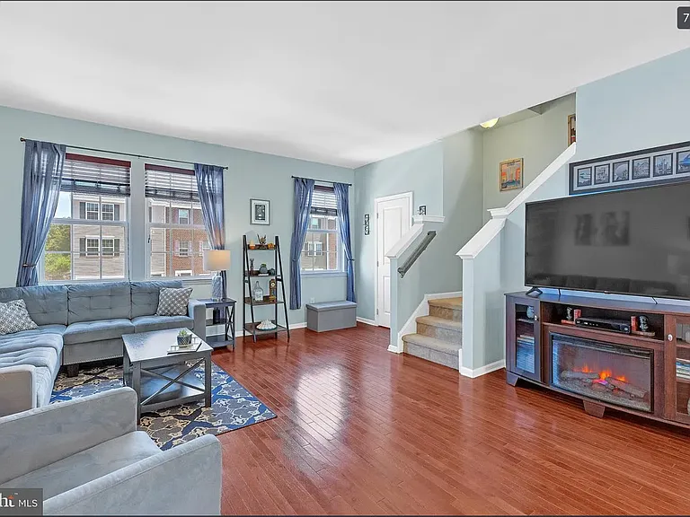 Photos of previous tenants' furniture. Place looks the same and in the same condition but with different furniture.