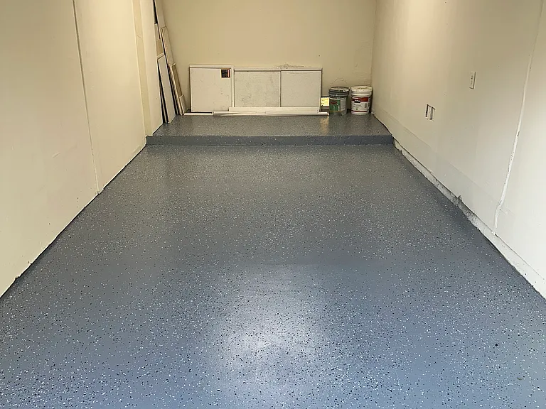 Remodeled garage w/ auto motion light and epoxy garage floor.Extra storage for bikes.