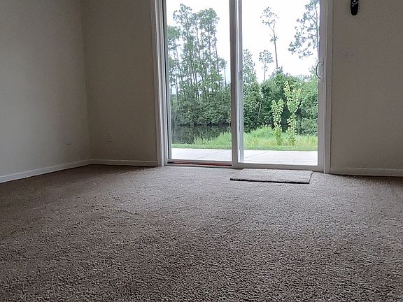 Master bedroom view of lake and natural surroundings