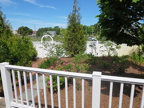View from deck overlooking garden area to gate- walk thru ga