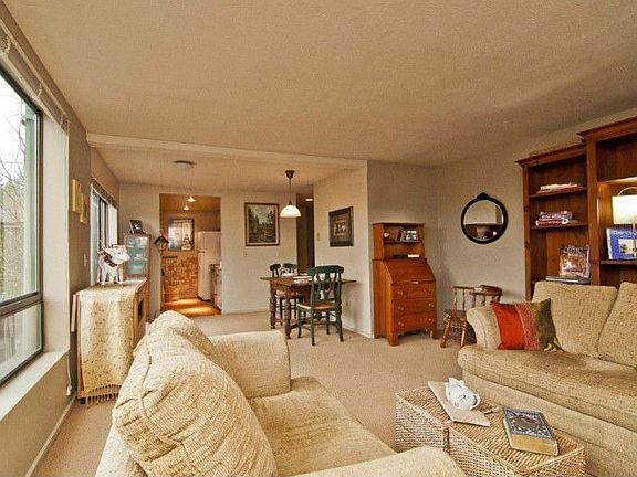 This is the view from the fireplace through the living room, dining area and into the kitchen.