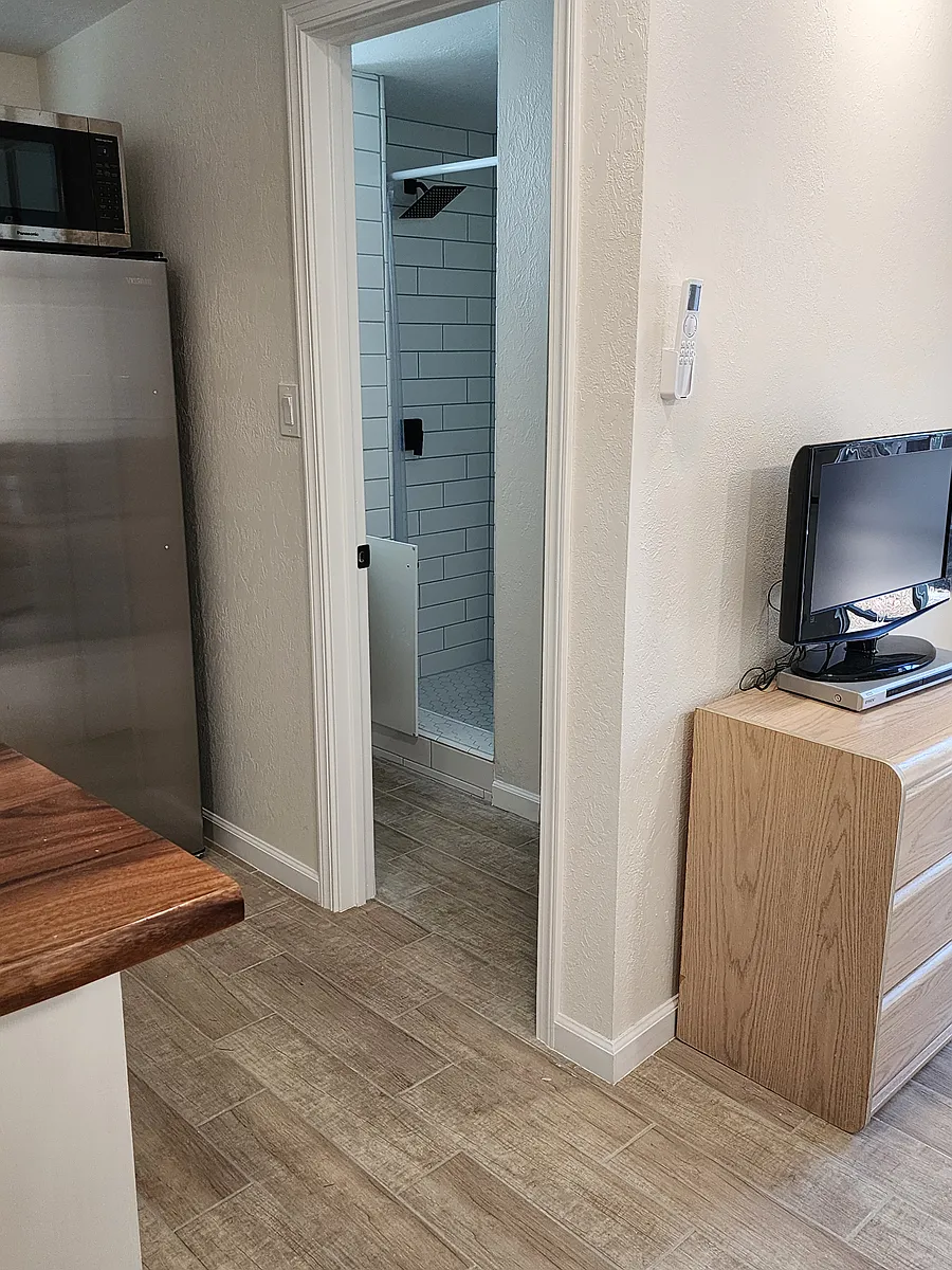 Fridge, Microwave, living edge counter , Looking into bathroom - 1509 Toro St