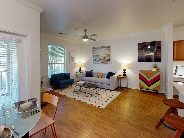 Apartment living room with wood-style flooring.