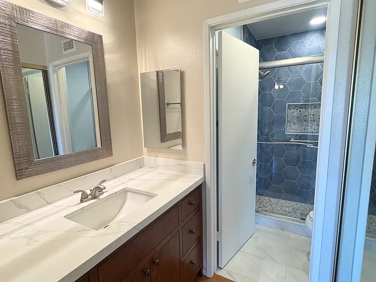 Primary ensuite bathroom with new vanity and fixtures