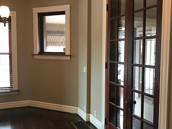 Beautiful French doors with natural stained wood.