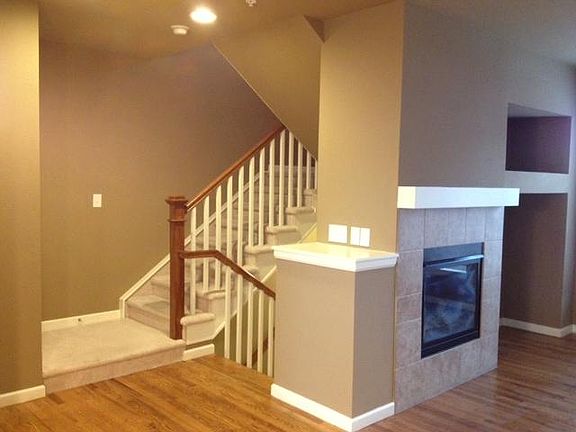 Interior toward stairs to 2nd floor and front entrance.
