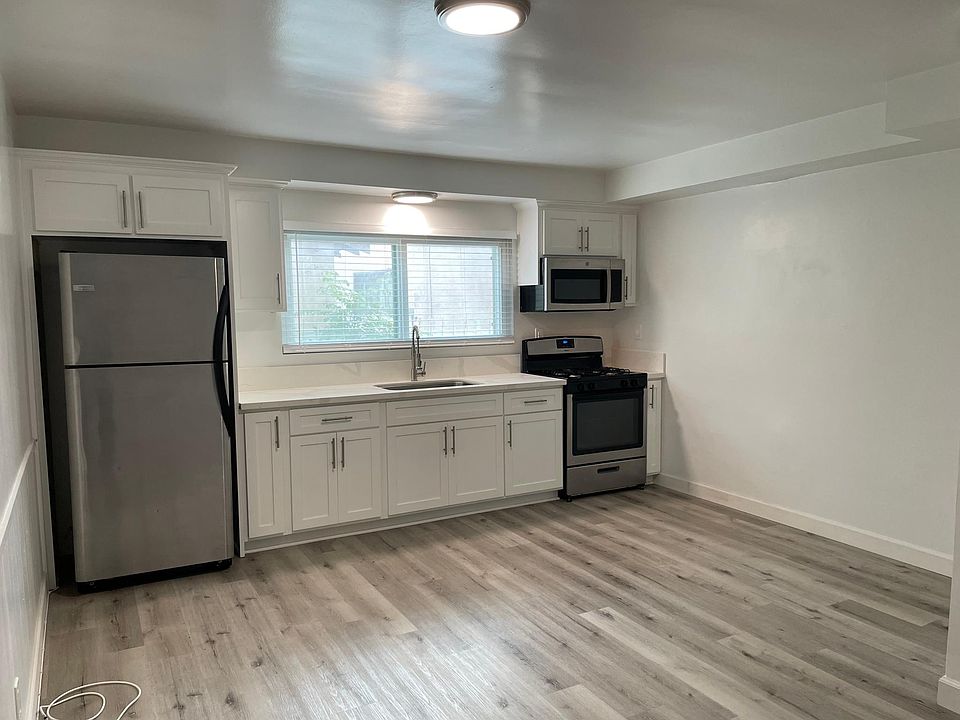 Kitchen with quartz countertops, and stainless steel appliances