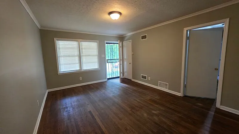 Charming Brick Home with Fenced Backyard & Carport — Photo 3