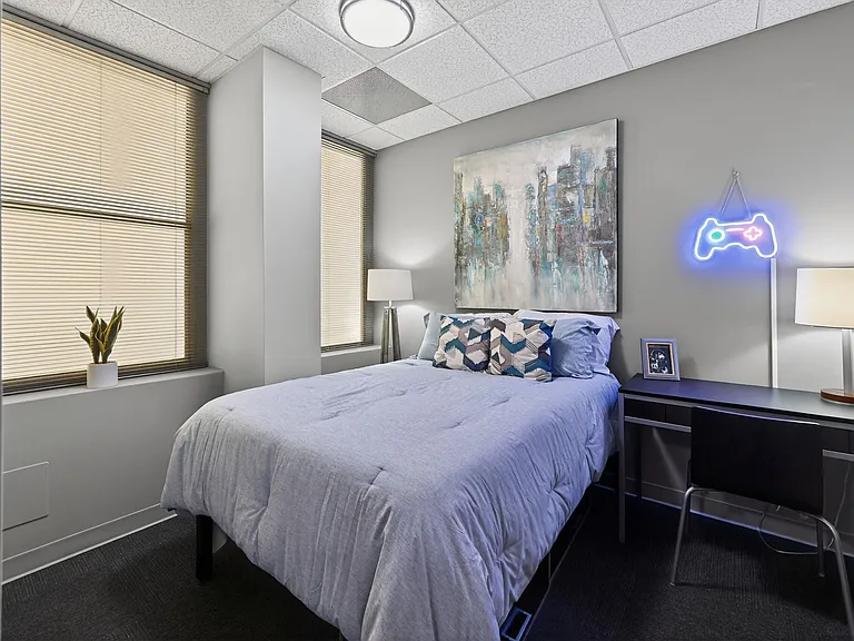 Spacious Carpeted Bedroom at University Plaza NIU Student Apartments