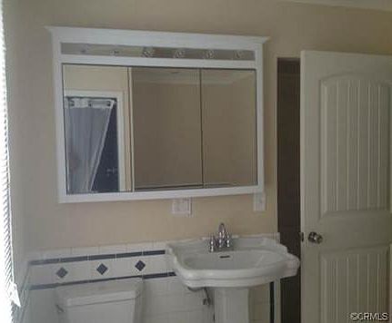 VIEW OF BATH #1 ELEGANT TILE DETAIL AND JACUZZI SPA WITH A STAND