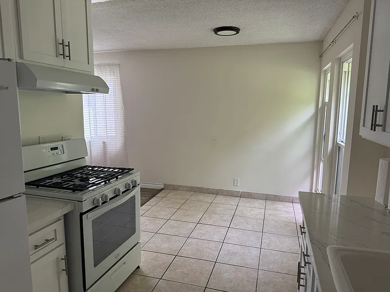 Dining room area from view of the kitchen.