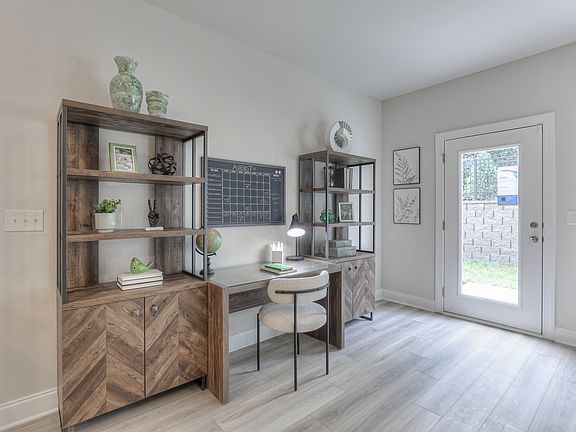 Create a study space to the right of the spacious kitchen.