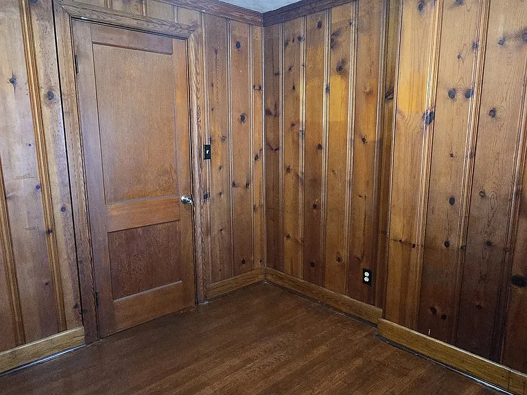Wood-paneled bonus room