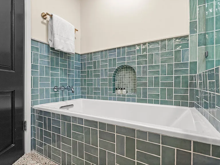 Lose yourself in layers of handcrafted tile and spa-like serenity.