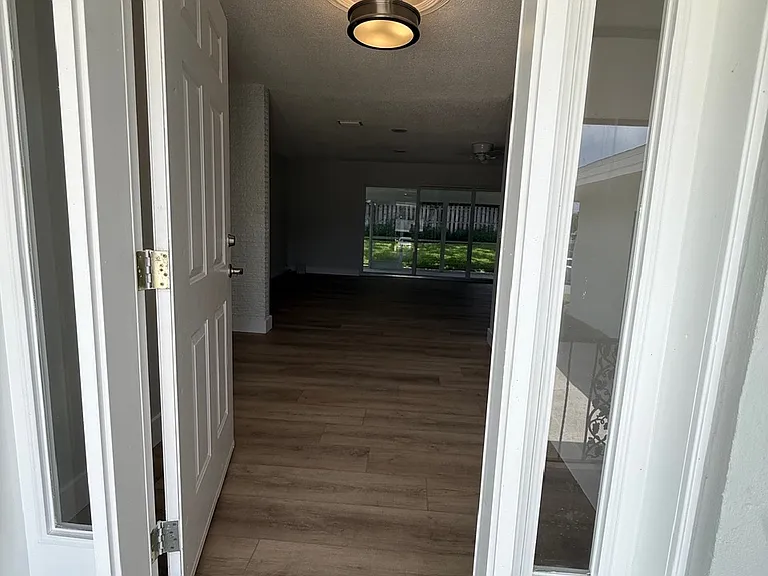 Front door entrance, kitchen to left, family room straight ahead