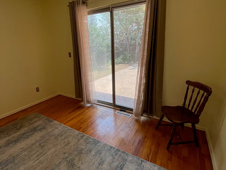 Third bedroom sliding patio door to backyard.