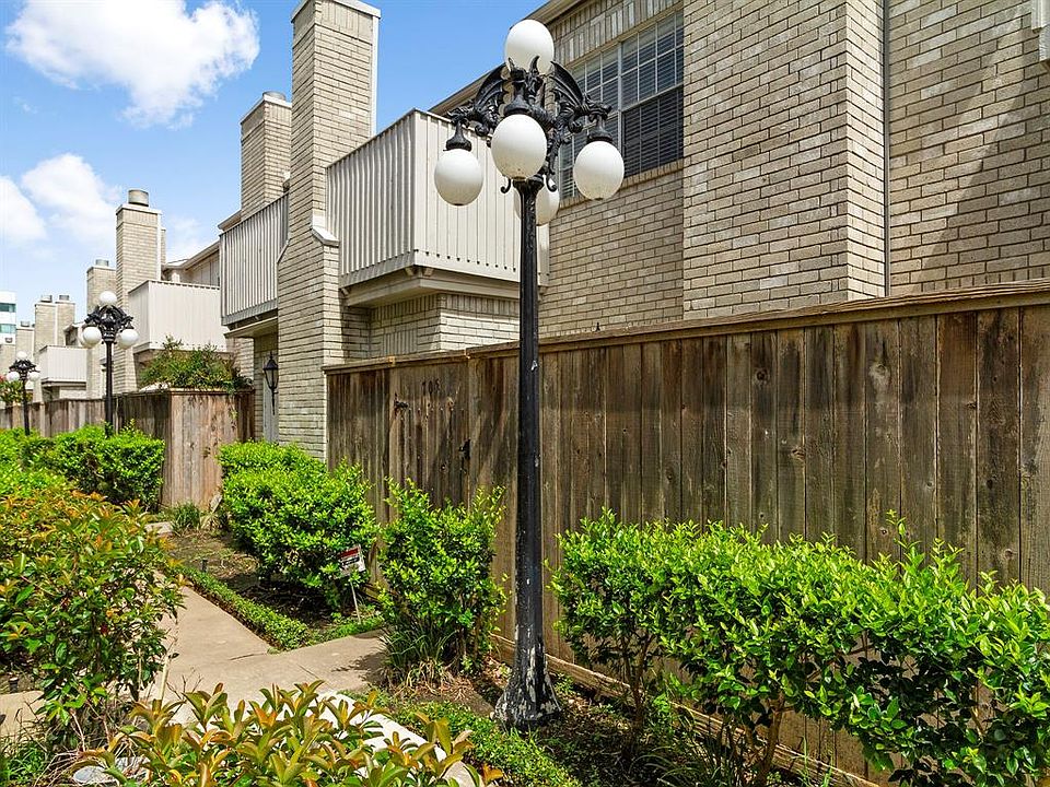 Front view. Private patio on the other side of the fence.