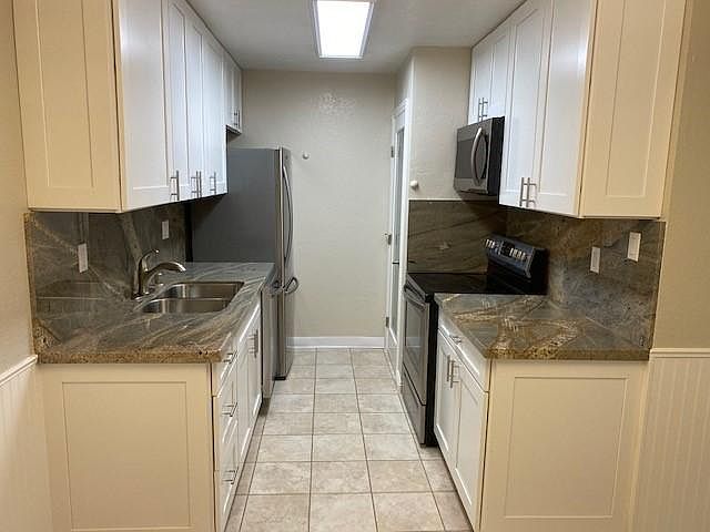 Kitchen is like new! New self closing cabinets, new granite and full backsplash, new sink, faucet, garbage disposal, new plumbing, new overhead light, new refrigerator, over, microwave, & dishwasher.