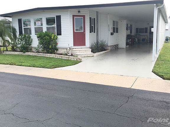 Front of home with carport
