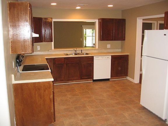 Taken from the eat in breakfast room looking into kitchen. Smooth top, self clean oven, dishwasher and refrigerator with ice maker.