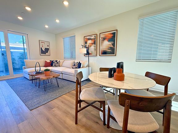 Plan 1A model home living and dining area with upgraded flooring