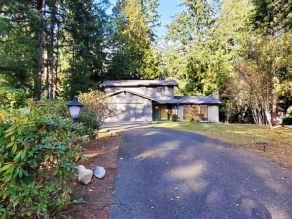 round-about driveway leading to the home & double car garage