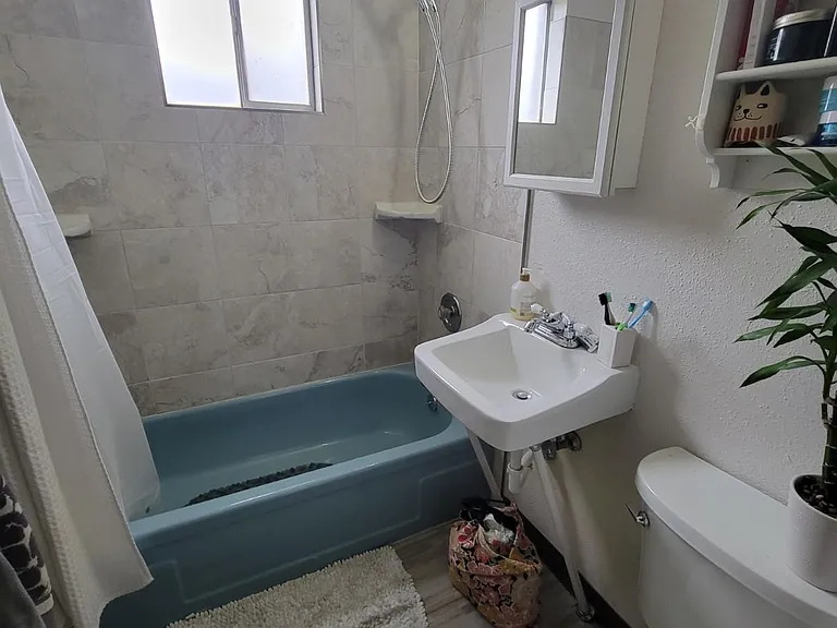 Comparable bathroom - newly re-tiled shower